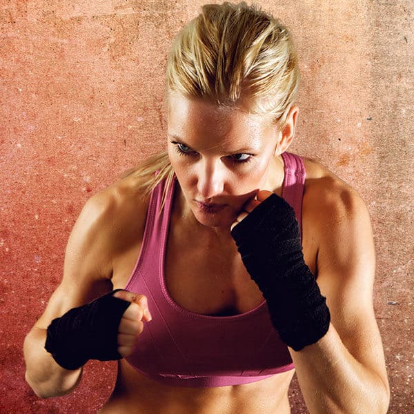 Mixed Martial Arts Lessons for Adults in Danvers MA - Lady Kickboxing Focused Background